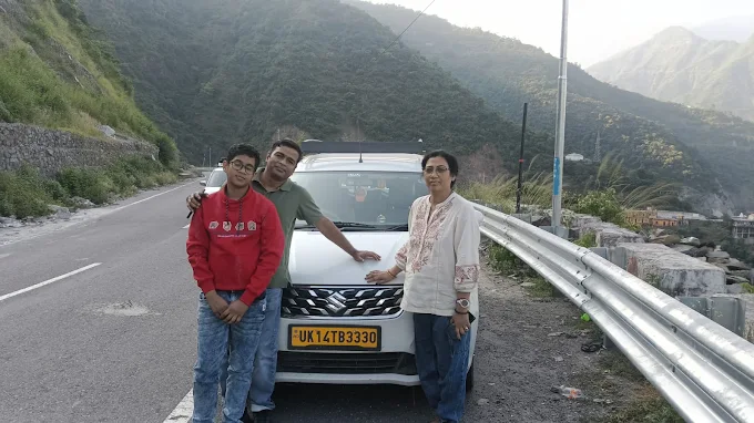 Family travelling in SUV taxi on Uttarakhand hill road to Kedarnath